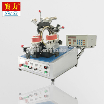 Machine for winding toroidal transformers
