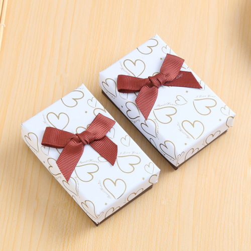 Pas kleine sieraden cadeau -doos verpakking aan met bowknot
