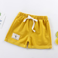 Pantalones cortos de deportes de algodón pantalones para niños