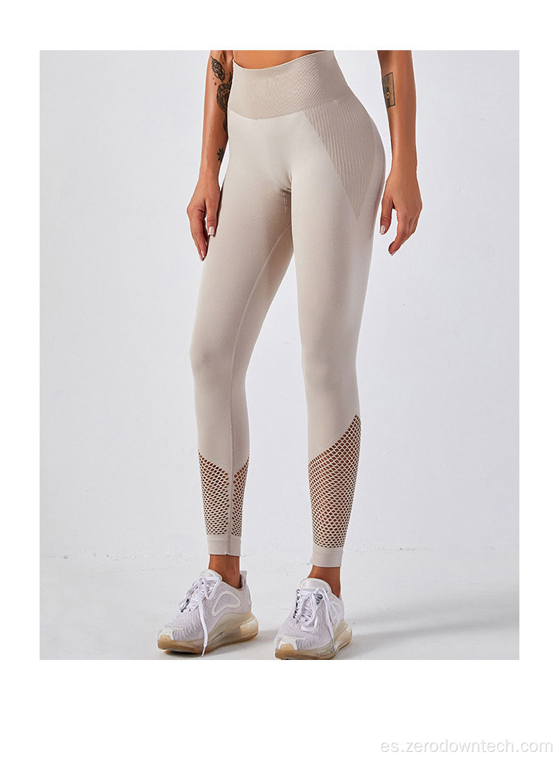 Traje de yoga de pantalones de fitness de chaleco hueco sin costuras de punto