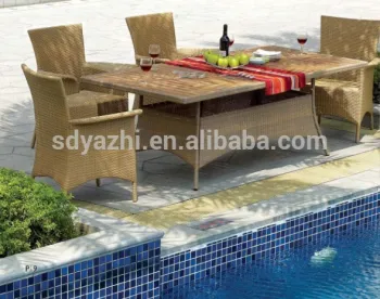 outdoor dining set in nature flat wicker includes six chairs and dining table with teak wood glass table top