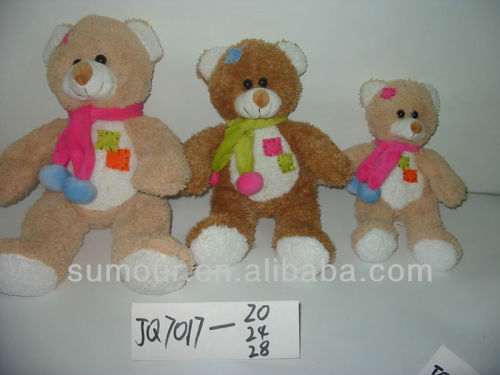 plush brown toy teddy bear with a ribbon