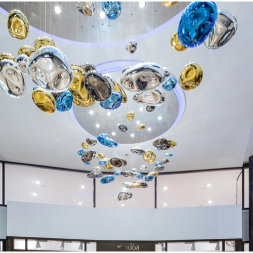 Large glass chandeliers used in hotel banquet halls