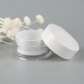 plastic cosmetic cream jar with white rose lid