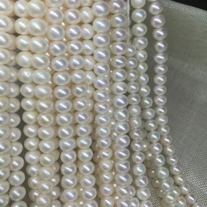 White or cream round fresh water loose water pearls with two holes for jewelry