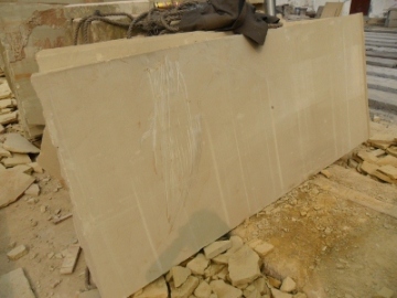 beige sandstone slabs machine cut 