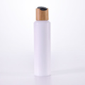 Slant shoulder white bottle with bamboo dispensing lid