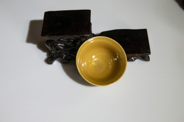 Small yellow glazed cup
