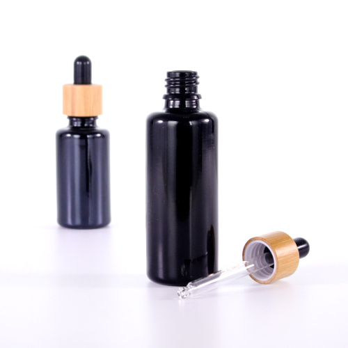 Black round shoulder essential oil bottle