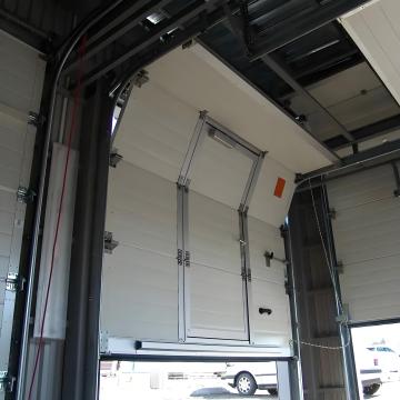 High speed rolling up overhead sectional door