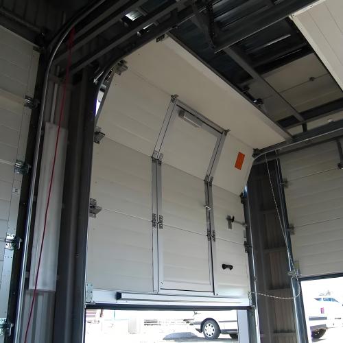 High speed rolling up overhead sectional door