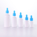 Opal white glass bottle with blue dropper