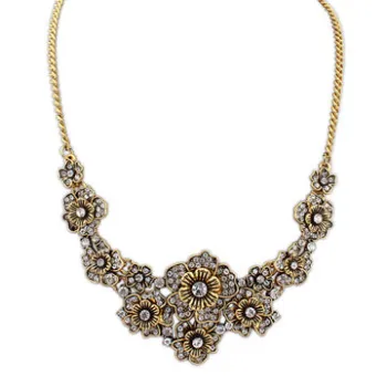 Retro metal necklaces, chains with rhinestones set on metal flowers in fashion design