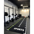 Césped artificial de patrón funcional integral para gimnasio.