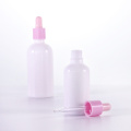 Opal white essential oil bottle with pink dropper