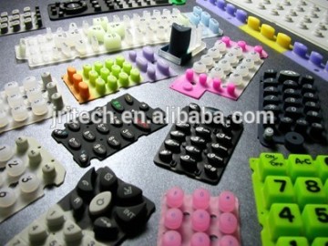 Conductive rubber keypad with an integral semi-conductive pill or carbon pills