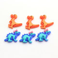 100 Stück / Lot Kawaii Resin Dinosaurier Cabochons Flatback Dino Cabs für Hairbow Center Verschönerung DIY Telefon Zubehör