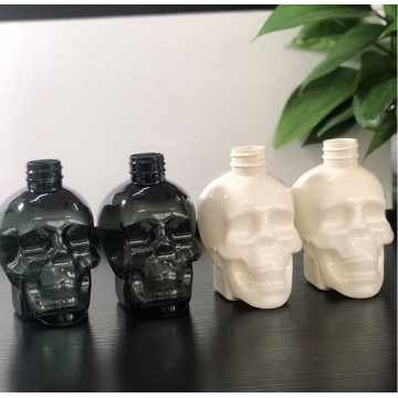 Botella de loción de forma de calavera de plástico de 350 ml con bomba