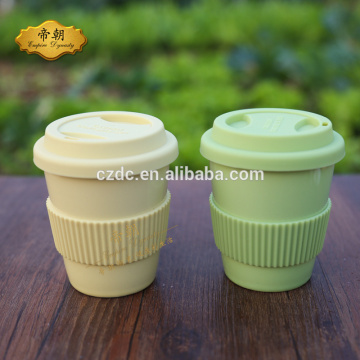 ceramic coffee cup with silicone lid and sleeve
