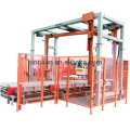 Combined automatic pallet wrapper with top sheet dispenser