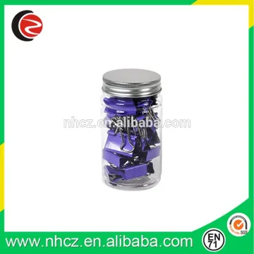 Mini Purple binder clips in glass bottle
