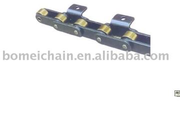 Double pitch transmission chain withattachments