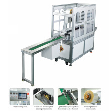 Efficient and easy-to-operate four-side packaging machine