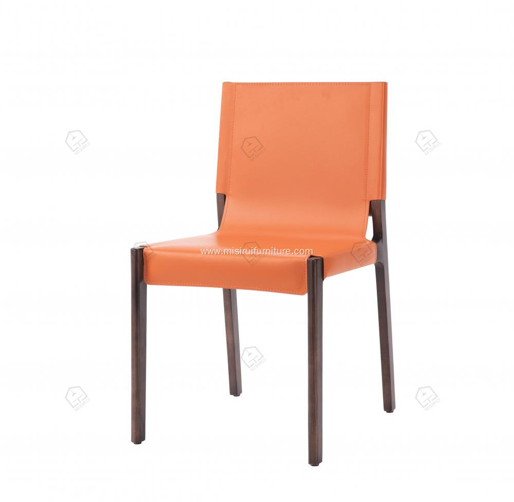 Orange saddle leather armless dining chairs