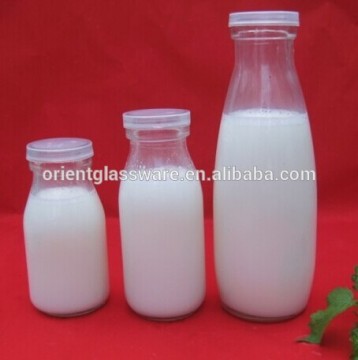 Different size clear milk glass bottle with lid