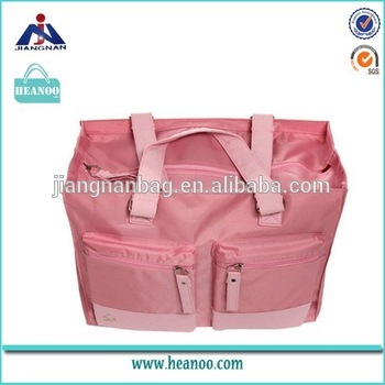 duffle-style diaper tote bag with larger compartment