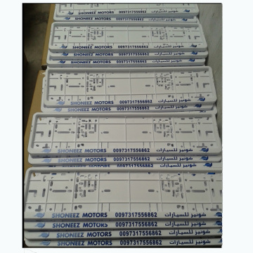 White plastic car license plate frame