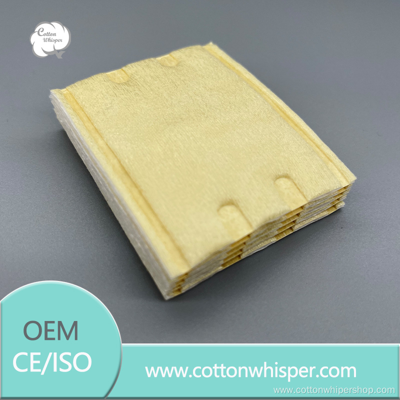 Yellow non-woven quilted square cotton pad