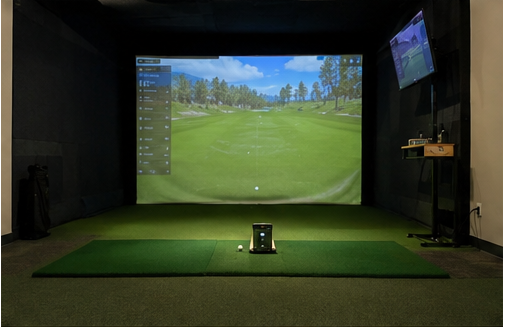Complete indoor golf simulator with launch monitor, hitting mat, and projection screen