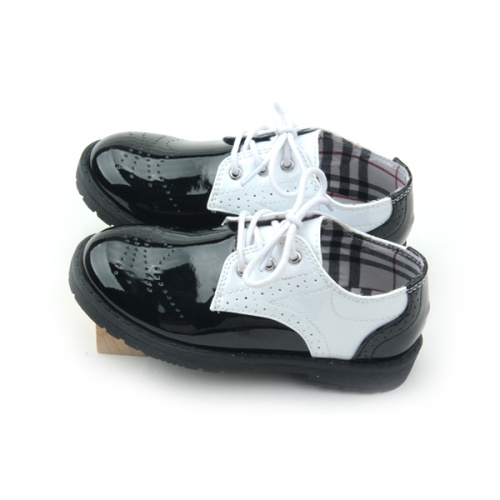 Zapatos casuales para niños en blanco y negro de cuero de Quanlity