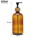 Boston round glass bottle with bamboo pump