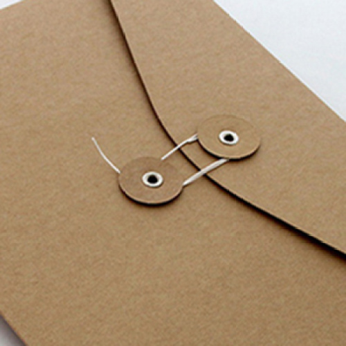 Brown kraft envelope with string and button