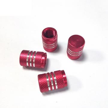 Tire valve stem caps with chrome stripes