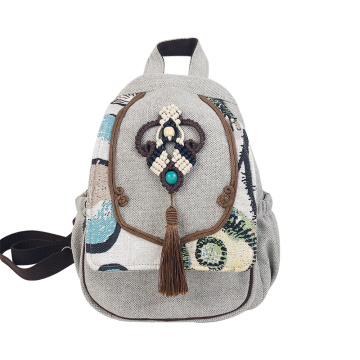 Mochila de lino con borlas Ruyi de estilo bohemio hecha a mano