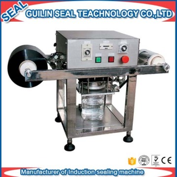 Wide-mouth plastic bottle aluminum foil sealing machine