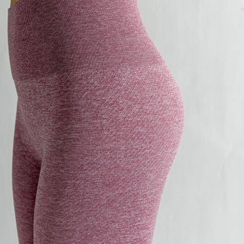 Розовые брюки для йоги с высокой талией.