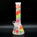 A glass water pipe with a colorful mushroom pattern