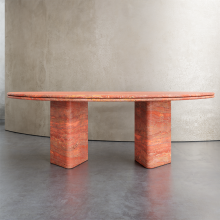 A semi-circular tabletop with triangular table legs dining table red