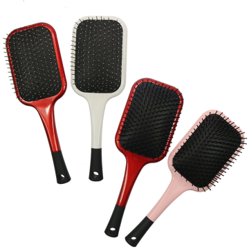 paddle hairbrush with nylon bristles and steel pins