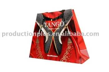 Fancy paper in trapezoid shape and finished with ribbon handles with special shaped