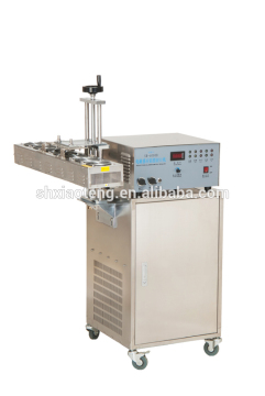 Aoutomstic aluminum foil sealing machine for medicine bottles