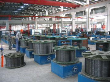 Vertical spool pay off machine for steel wire production plant