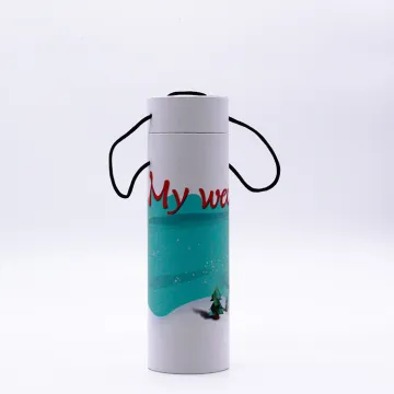 Customized Christmas paper tube packaging box with ribbon