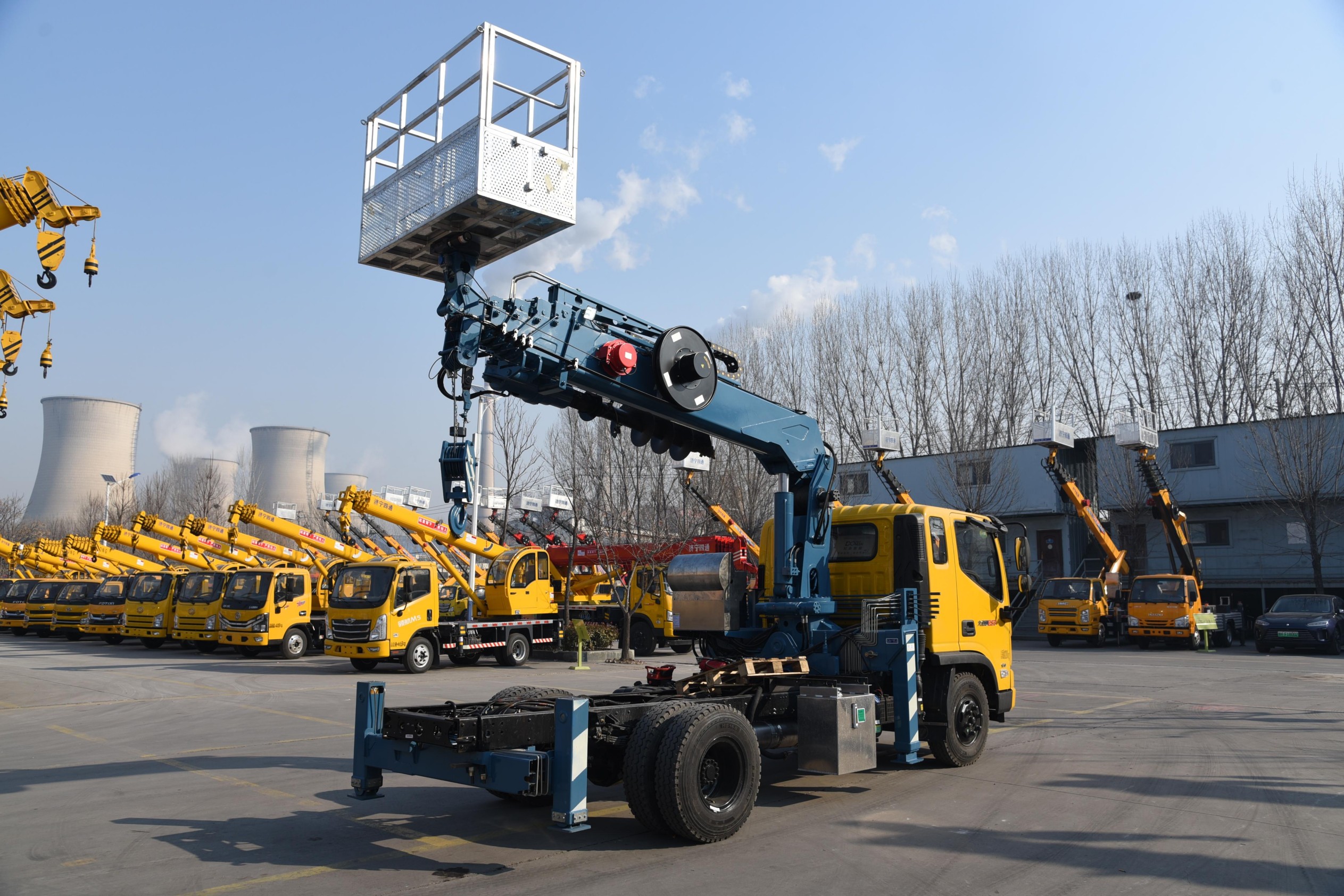 Multi-functional truck-mounted crane with drill bit