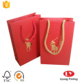 Red Paper Gift Bag with Gold Logo