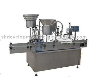 Vial liquid filling, stoppering and crimping machine